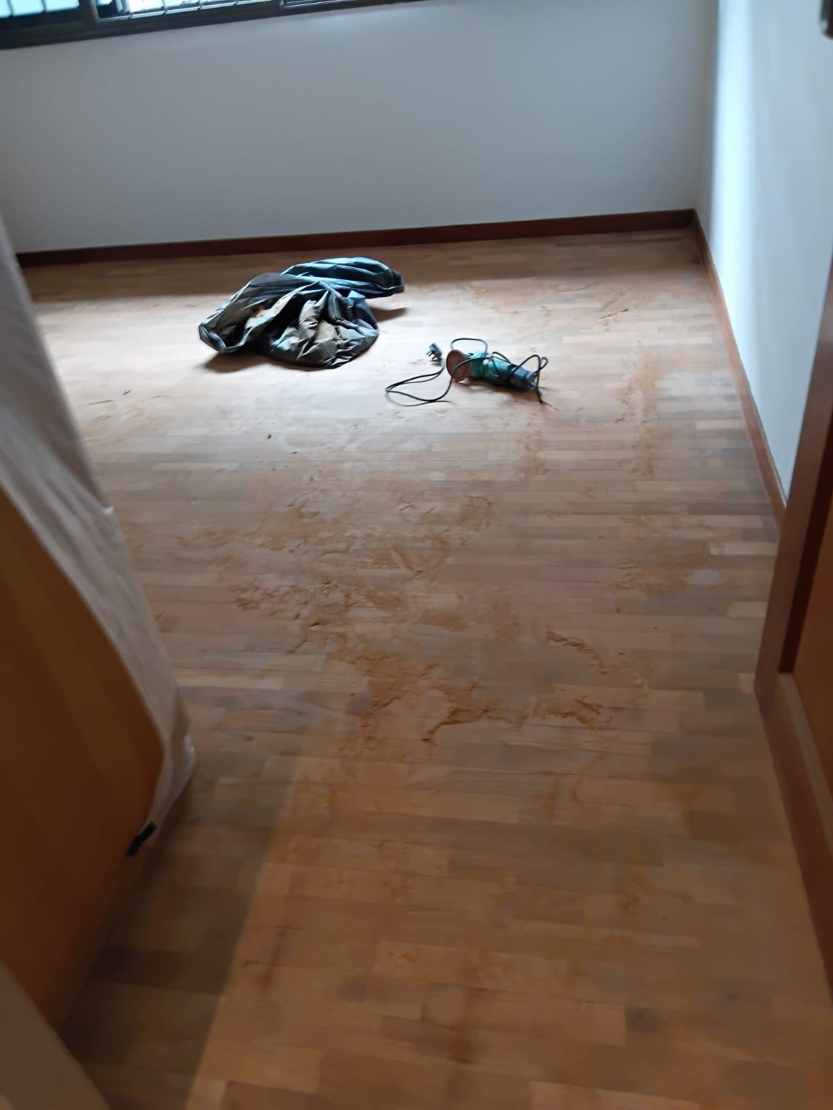 Professional Parquet Flooring Sanding & Finishing Dust-free wooden parquet polishing and sanding results showing restored natural wood grain.